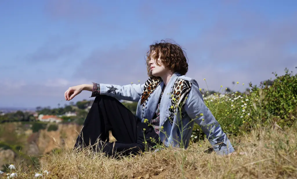 Woman sitting on a hill